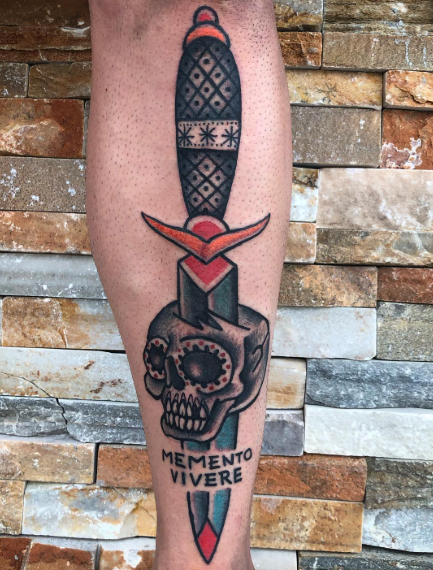 American Traditional dagger through a skull with “Memento Vivere” banner tattoo by Josh at Electric Street Tattoo, Fort Lauderdale