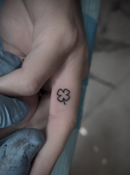 small finger tattoo