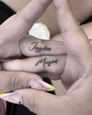 tiny finger name tattoo