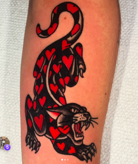 American Traditional red panther covered in hearts tattoo by Josh at Electric Street Tattoo, Fort Lauderdale