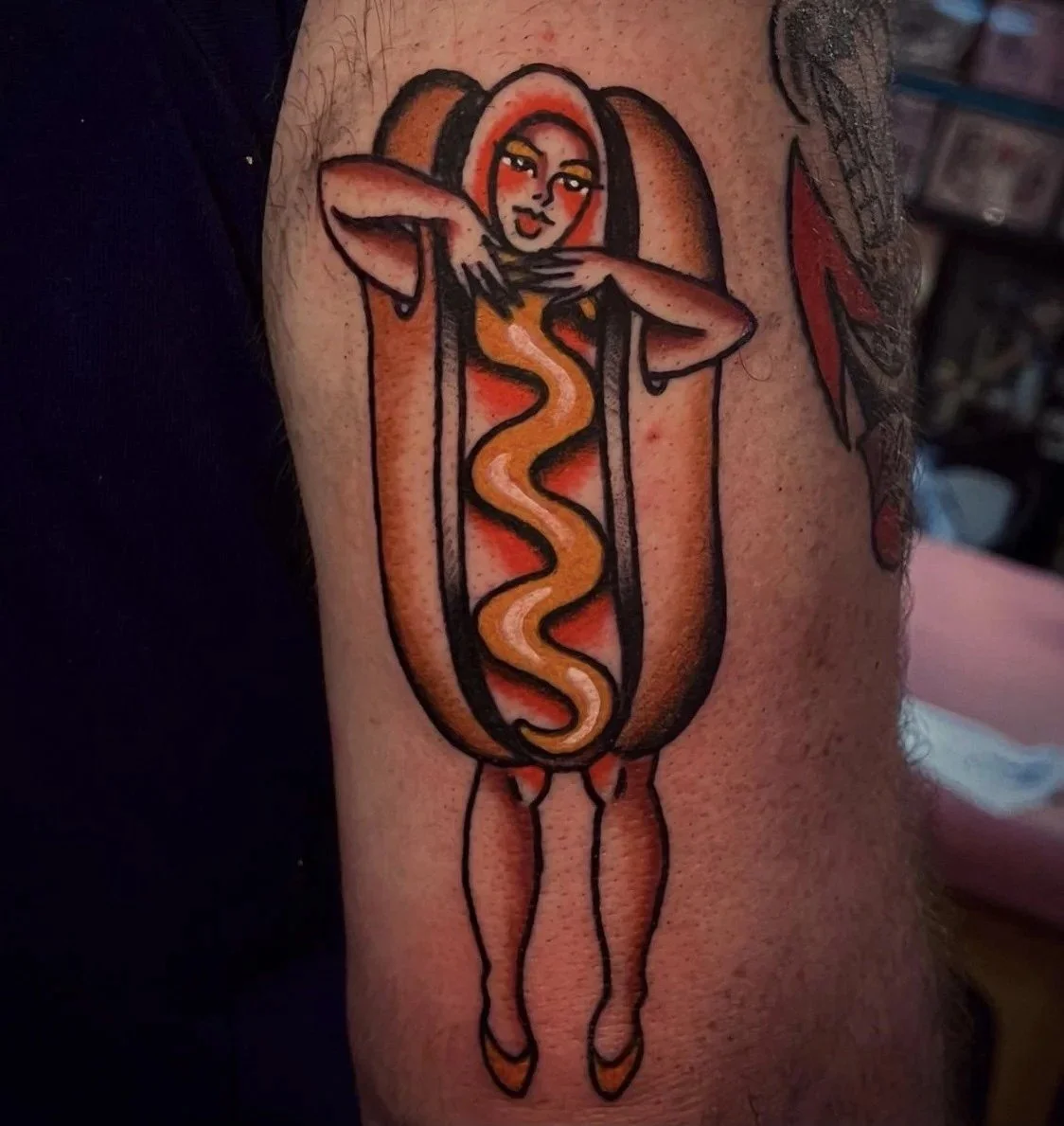 Hot dog costume pinup tattoo on an arm at Electric Street Tattoo, Fort Lauderdale