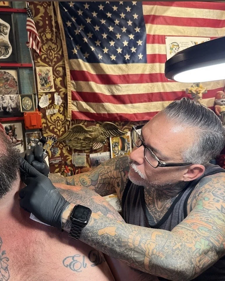 Josh Cabrera tattooing a client at Electric Street Tattoo, Oakland Park