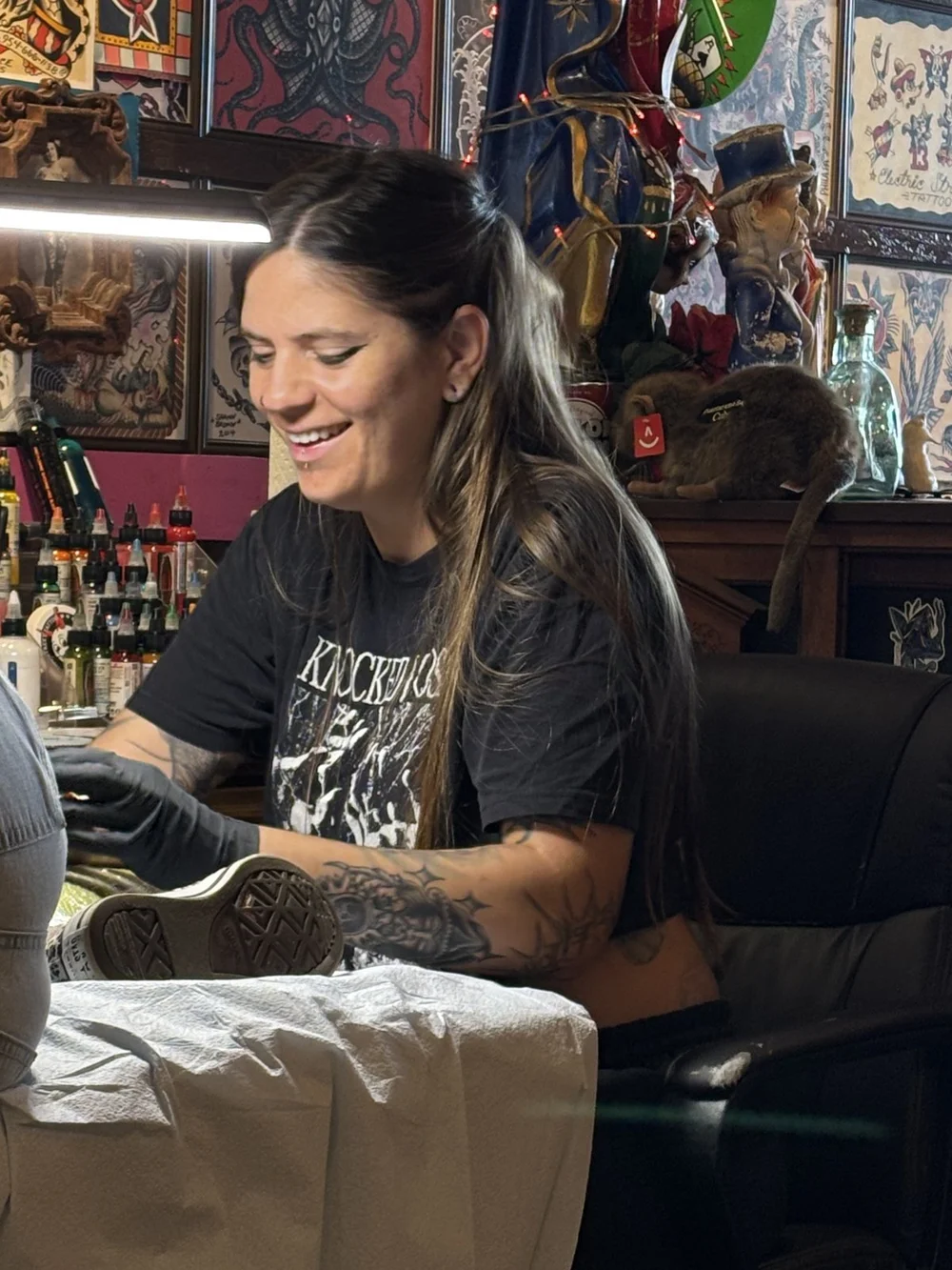 Lexi tattooing a client at Electric Street Tattoo, Oakland Park