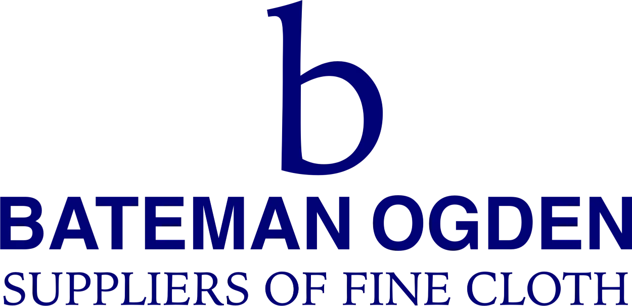 Logo for Bateman Ogden, suppliers of fine cloth, featuring a large blue lowercase 'b' above the company name in blue, with the tagline 'Suppliers of Fine Cloth' in smaller font below.