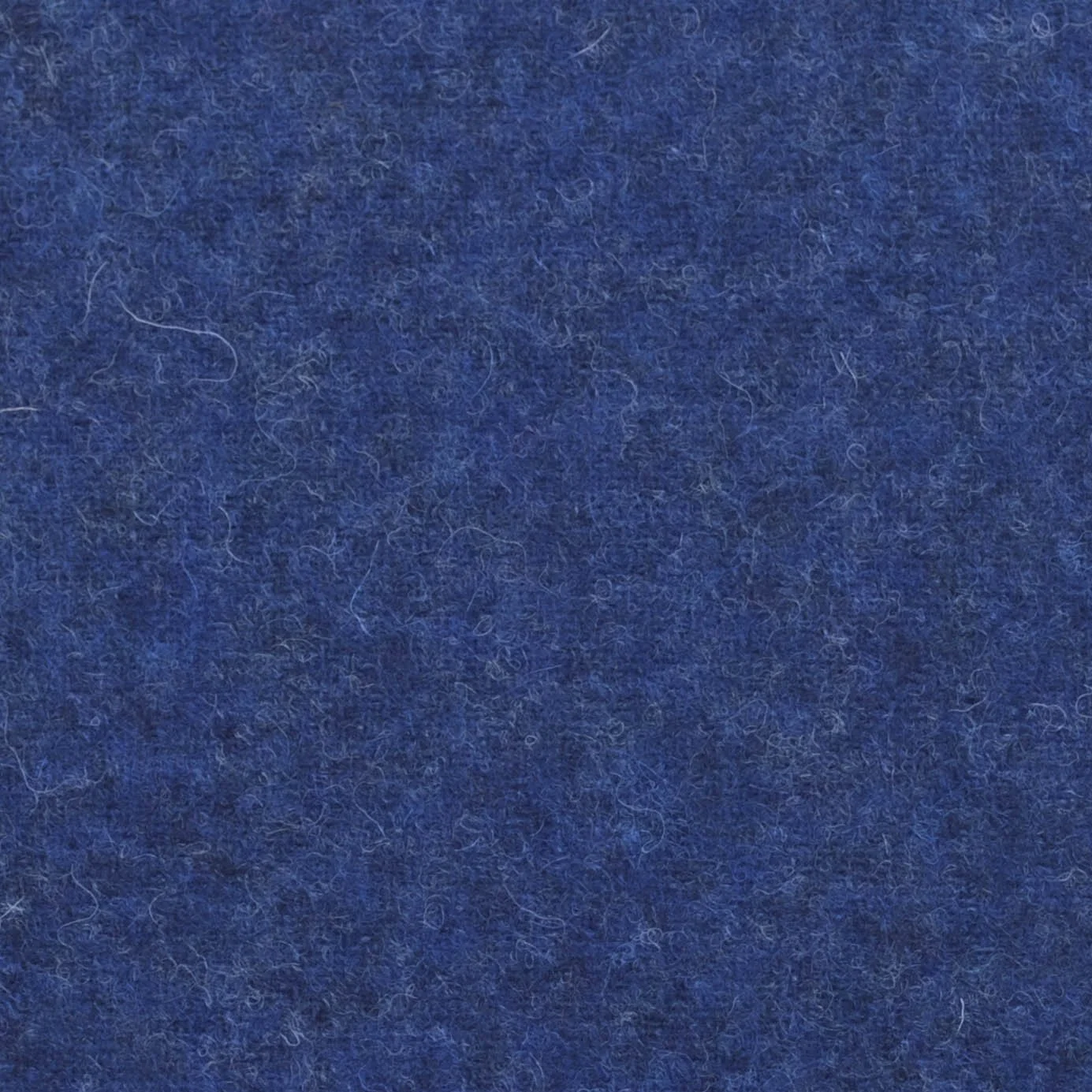 Close-up of blue fabric with visible fibers and texture.