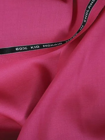 Close-up of pink fabric with a black and white label that reads '60% Kid Mohair'.