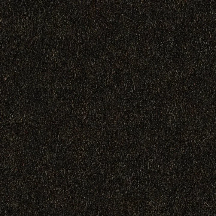 Close-up of black leather surface with a textured grain pattern.