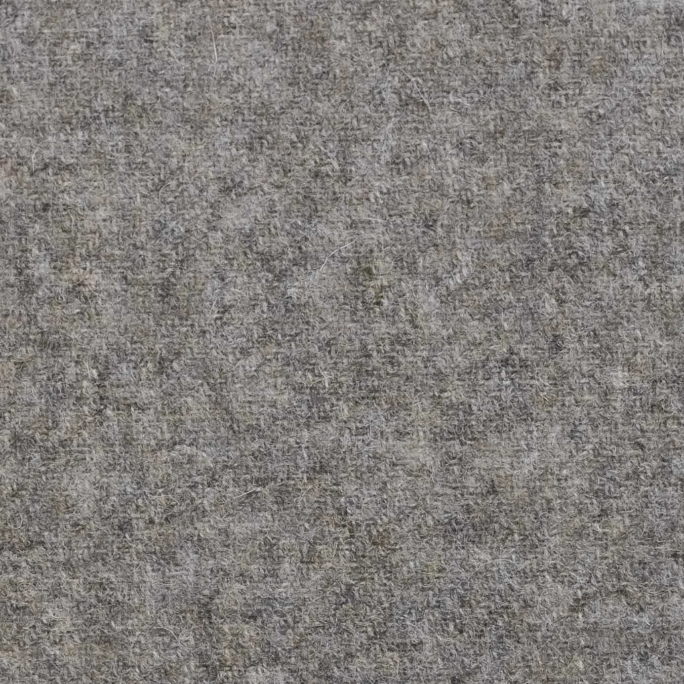 Close-up of a textured gray fabric surface.