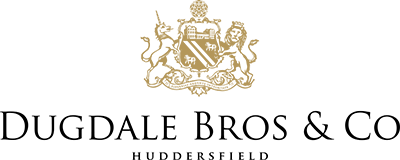 The image features a black and white photograph of a man in a formal suit standing next to a woman in a white dress. They are posed outdoors, with the man holding a bouquet of flowers. The background shows trees and a building, suggesting a celebratory or wedding scene.