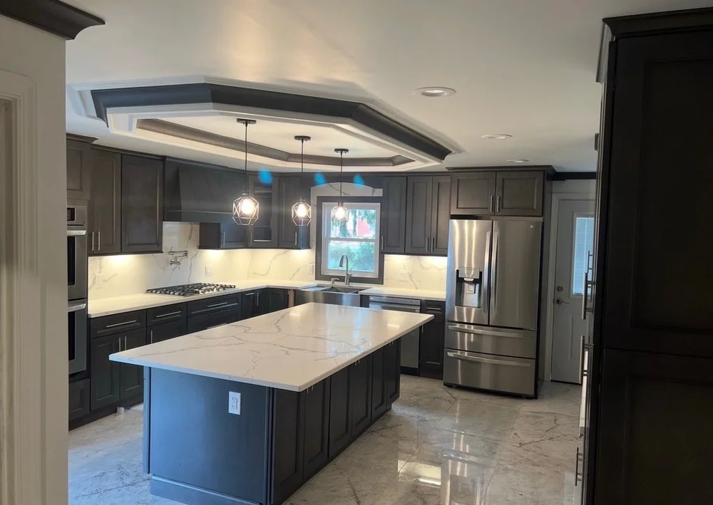 Custom kitchen remodel by Omar Construction in Bergen County, NJ — featuring custom cabinetry, quartz countertops, and modern lighting design.