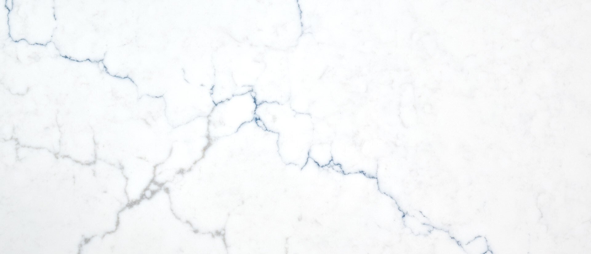 Calacatta Miraggio Cielo: white back ground with blue and gray veins giving cloud effect 