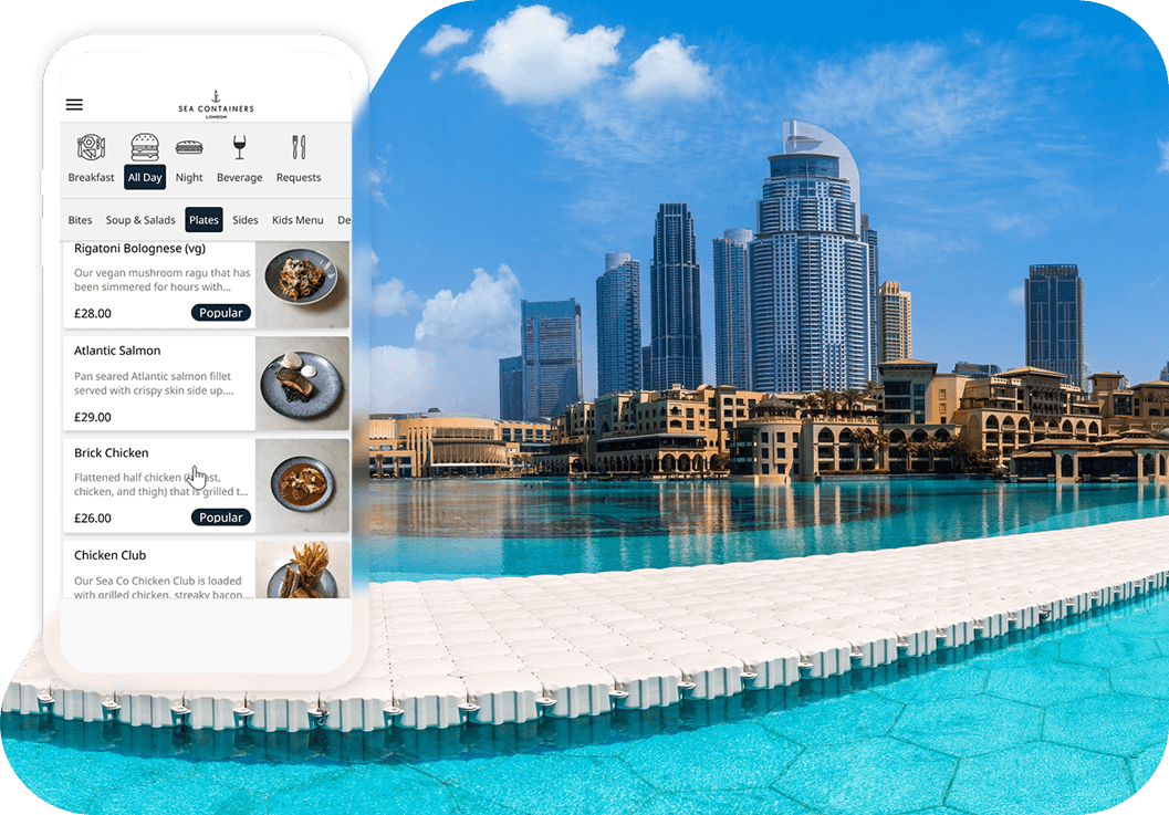 Sea Containers mobile dining menu displayed on a smartphone beside a hotel swimming pool and city skyline.