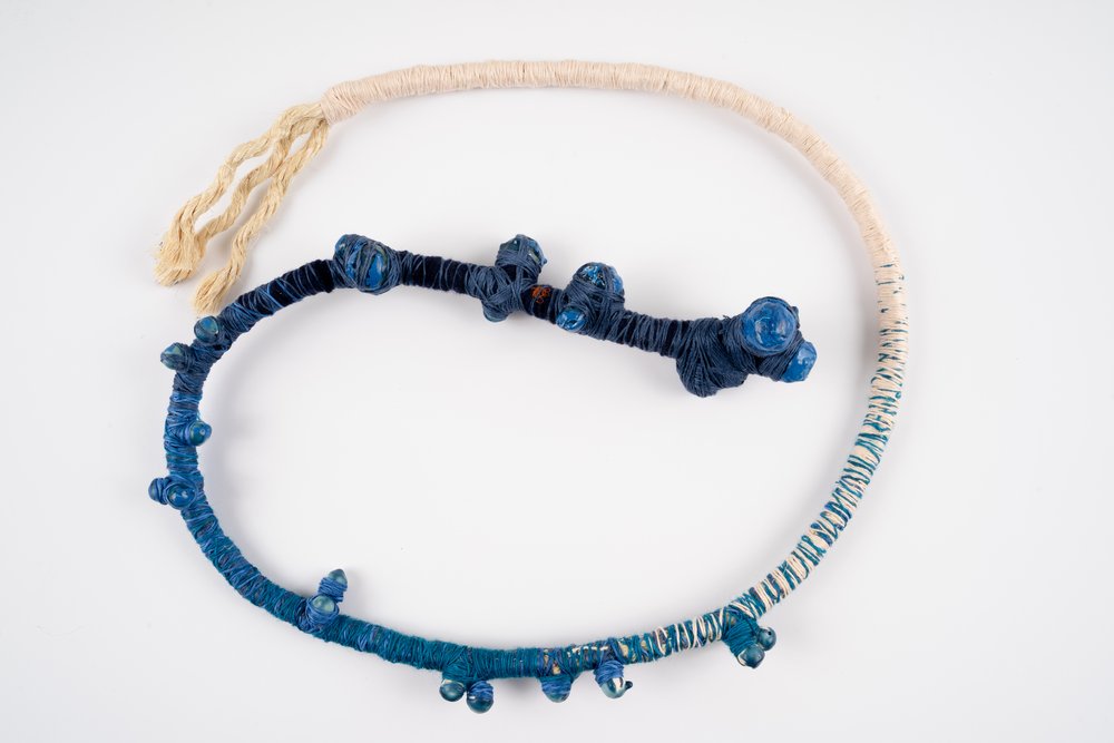  Charlotte Munn-Wood Imaginary Animal #1 2023 sisal rope, mixed fiber yarn, wood beads, candle wax, acrylic paint 30_ long, maximum x 1.5_ wide 