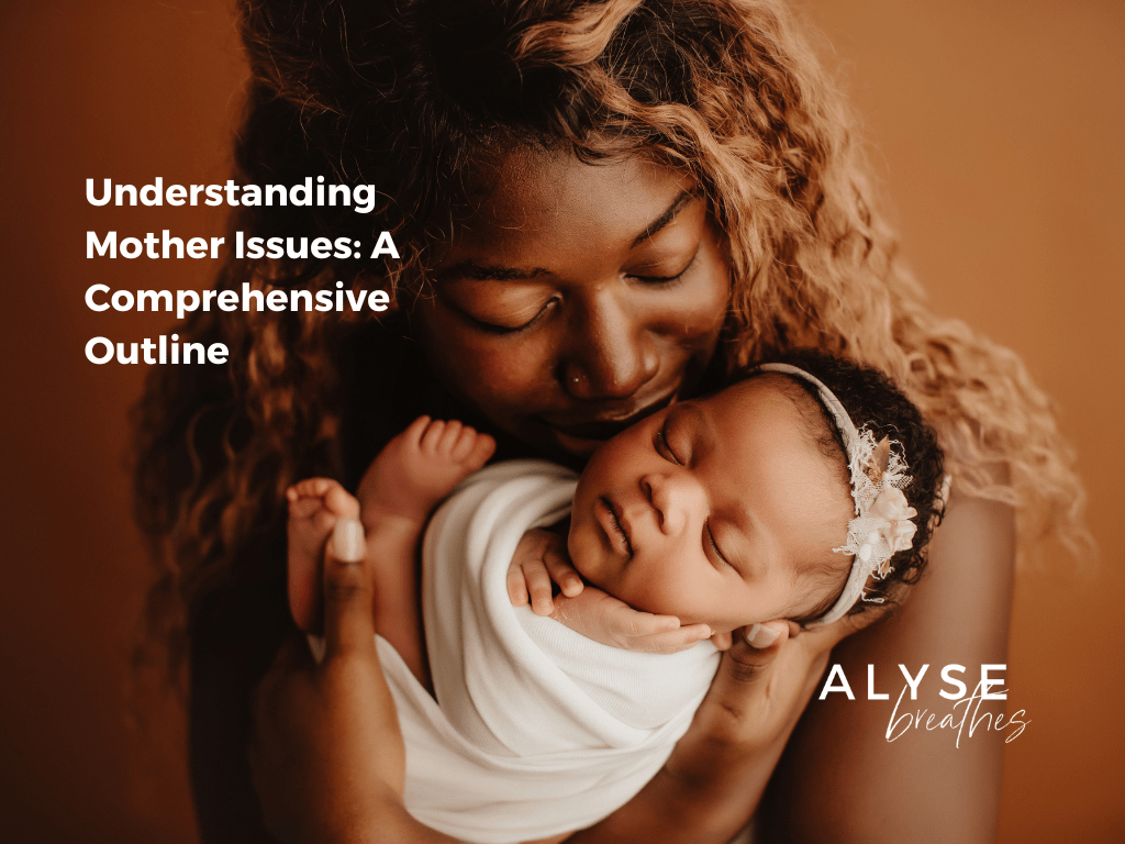 mother kissing her new born daughter as she's wrapped in a blanket
