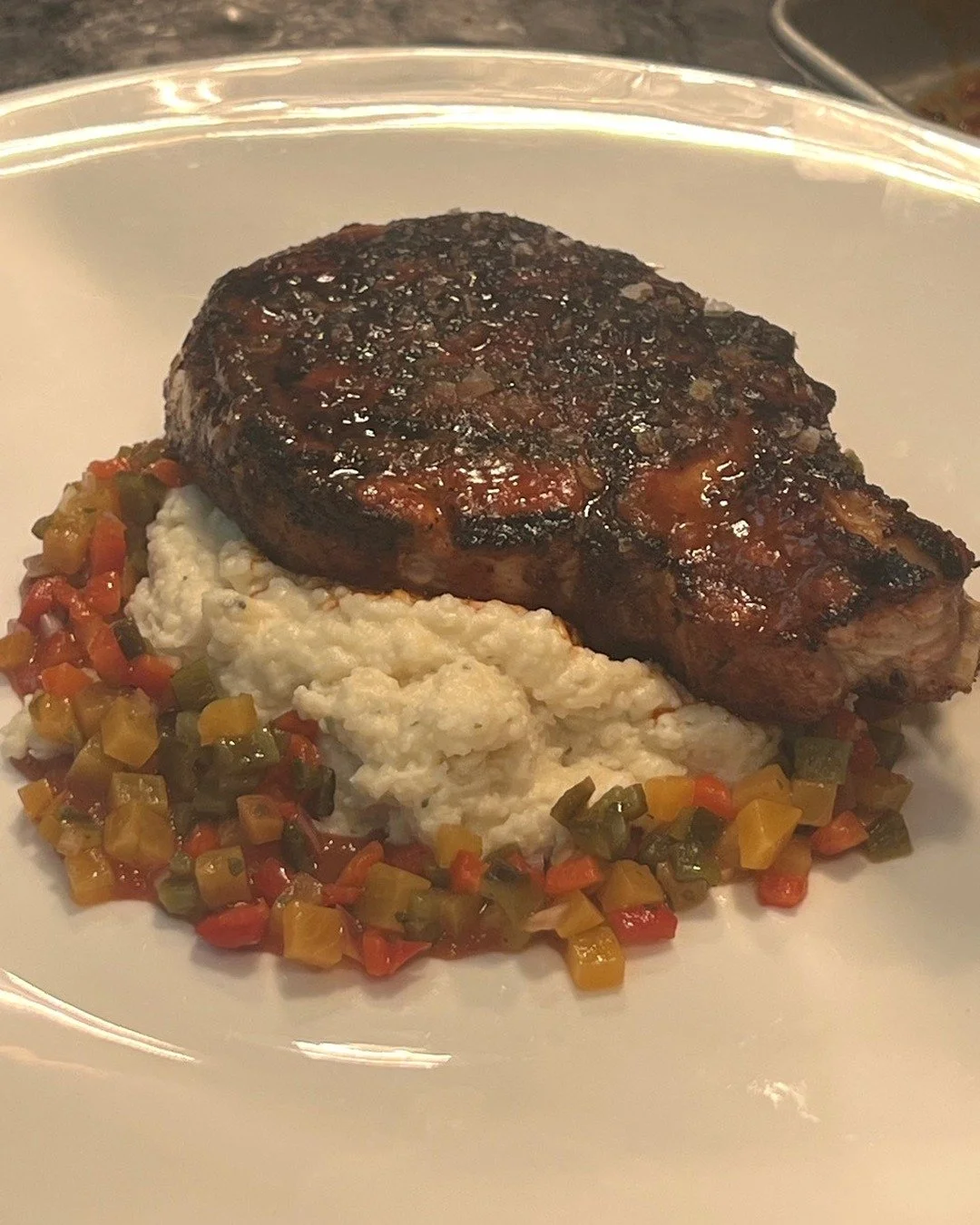 Berkshire pork chop. Peach-bourbon barbecue. $45.

This dish has been on our menu for quite some time. Although we change our menu all the time, this pork chop is just so good, I can&rsquo;t take it off!

Available on our dinner menu Thursday through