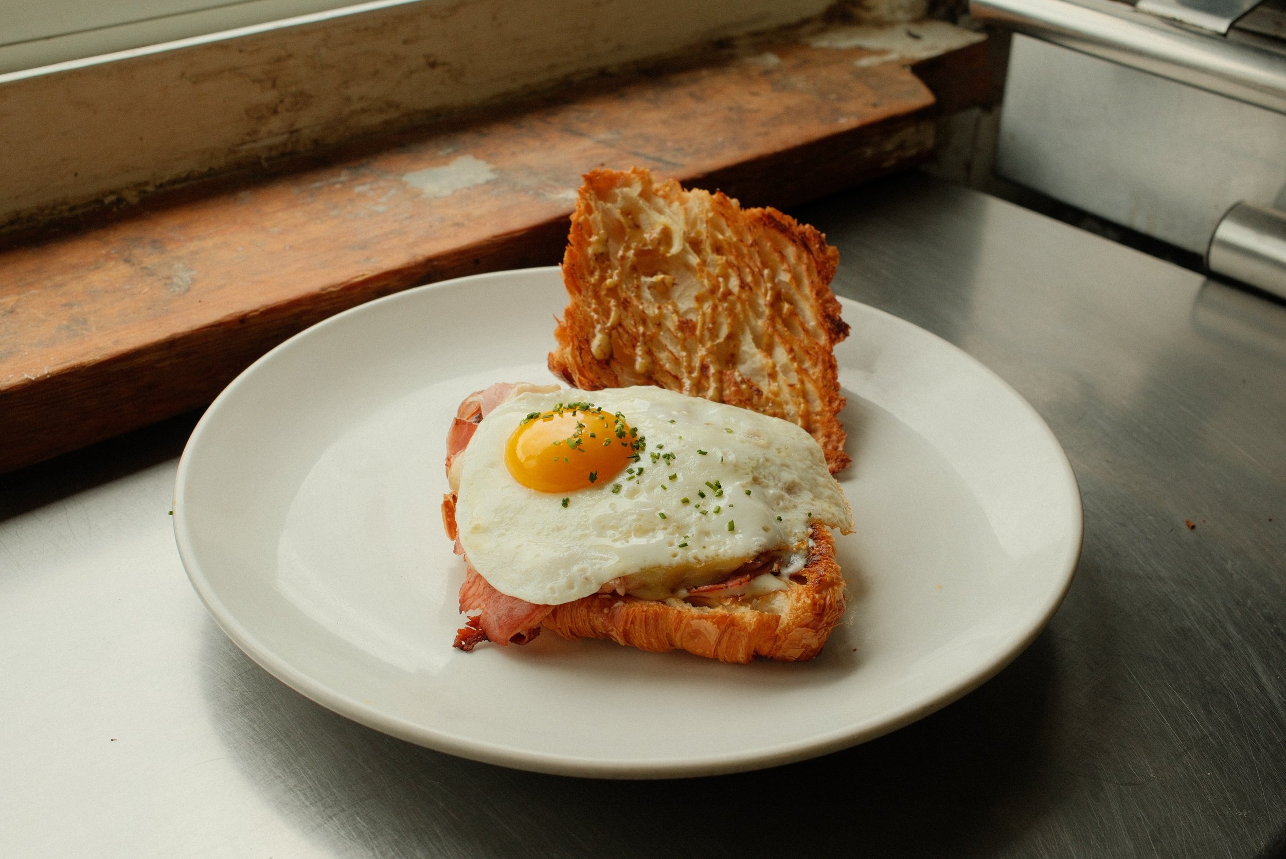 Croque Madame&hellip;

When Blue Door was in its infancy, we wanted to offer a great breakfast sandwich on our menu and obviously this French classic was a shoe in. 
But since we specialize in laminated pastry, well why not on a croissant. 
Although 