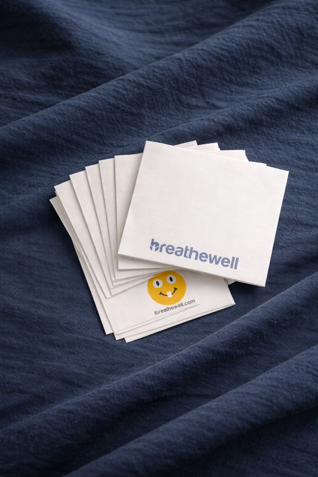 BreatheWell packets on blue sheet.png