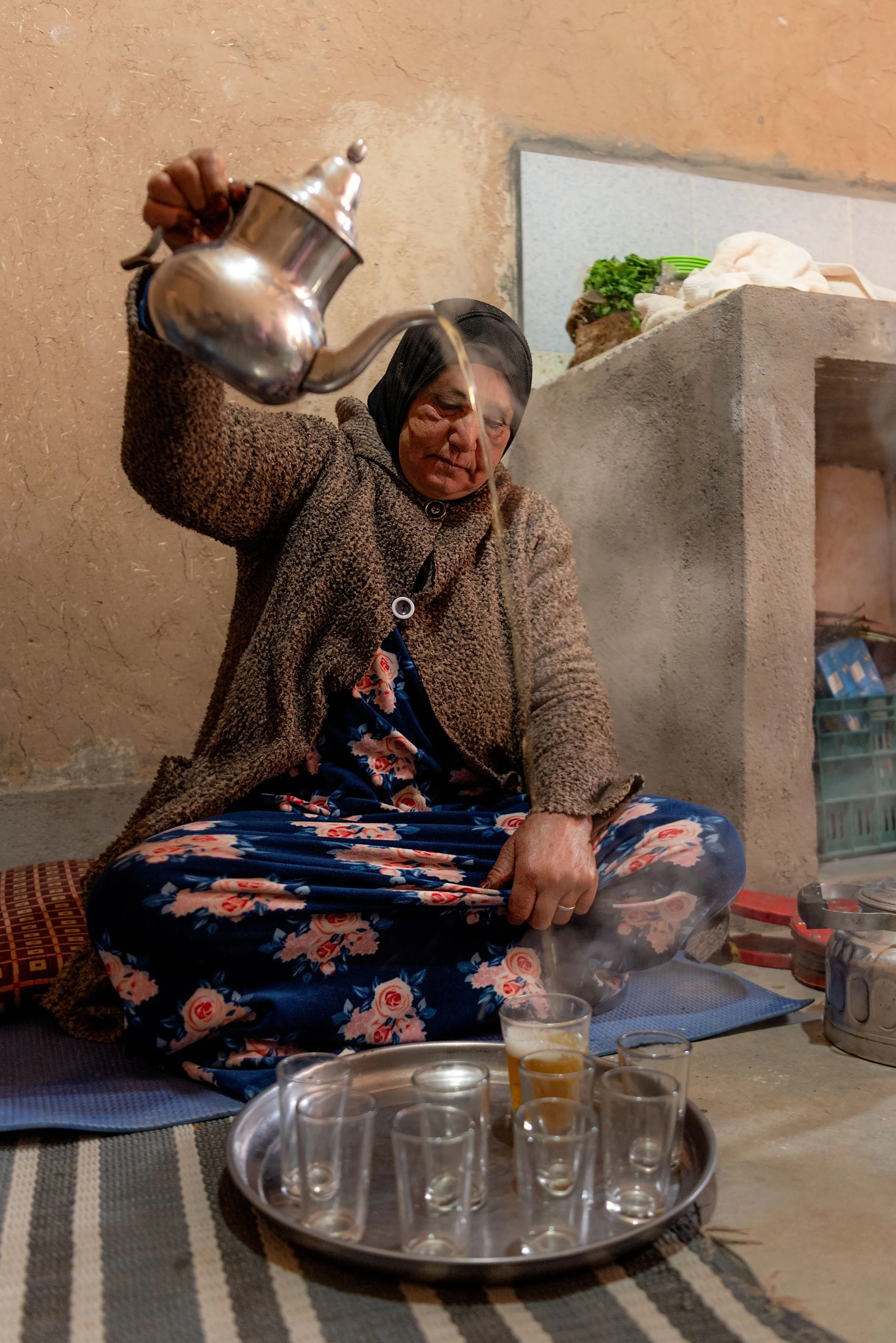 Morocco-Agouti-Village-Mama-Bia-pouring-tea-3.jpeg