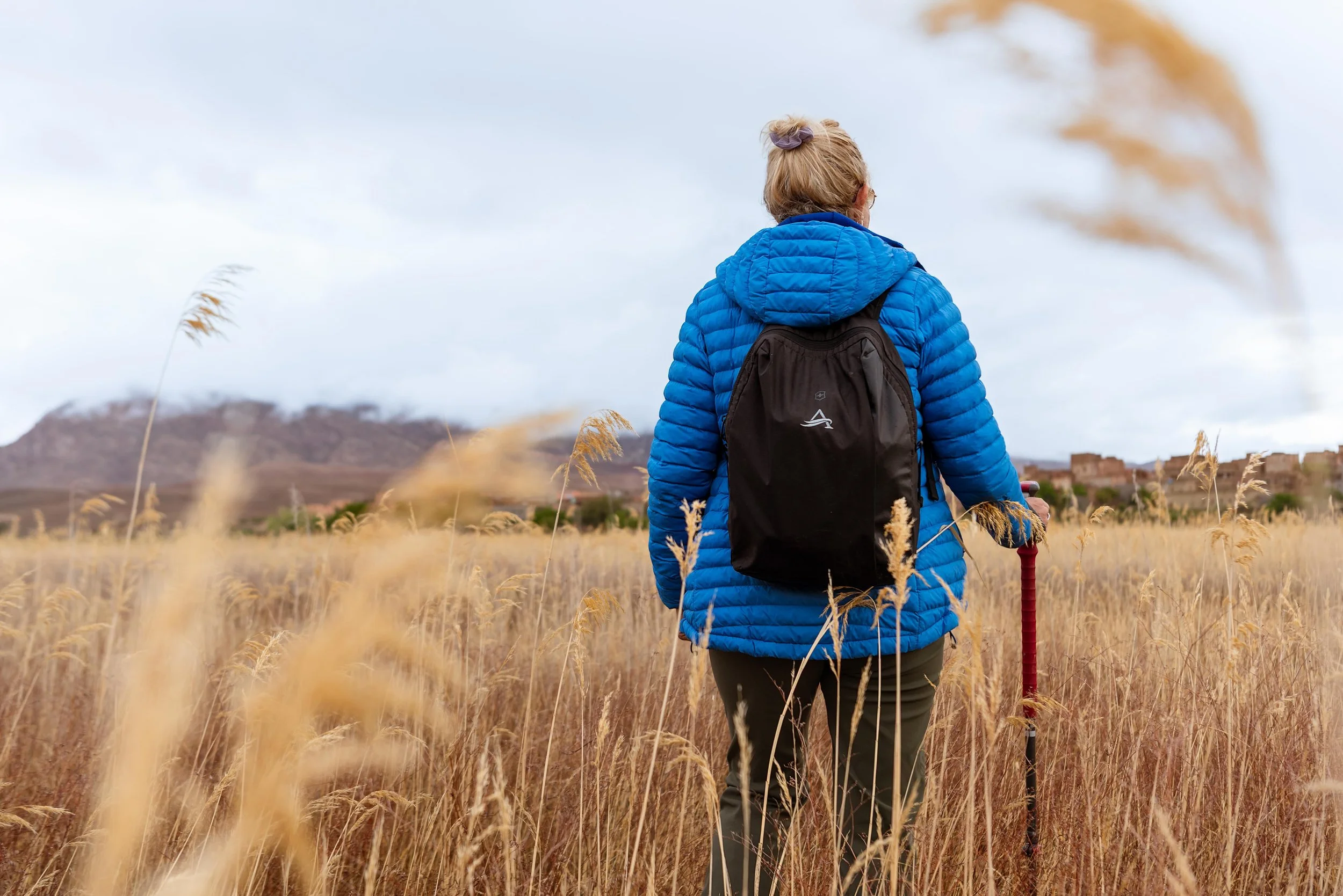 Morocco-Womens-Expedition-trekking-traveller-Carolyn-in-wheat-field-2.jpeg