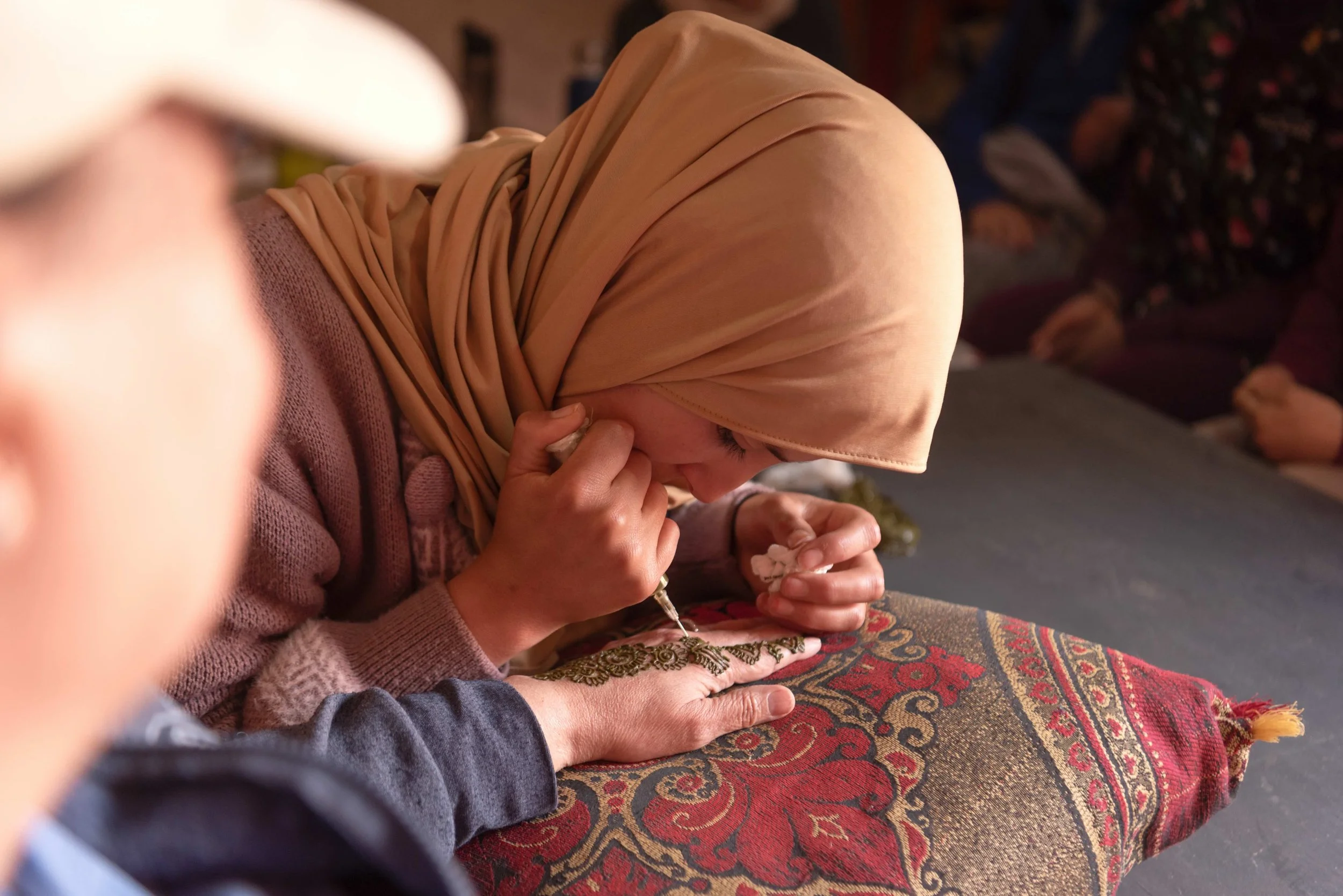 Morocco-Issoumar-Womens-Expedition-traveller-getting-henna-4.jpeg
