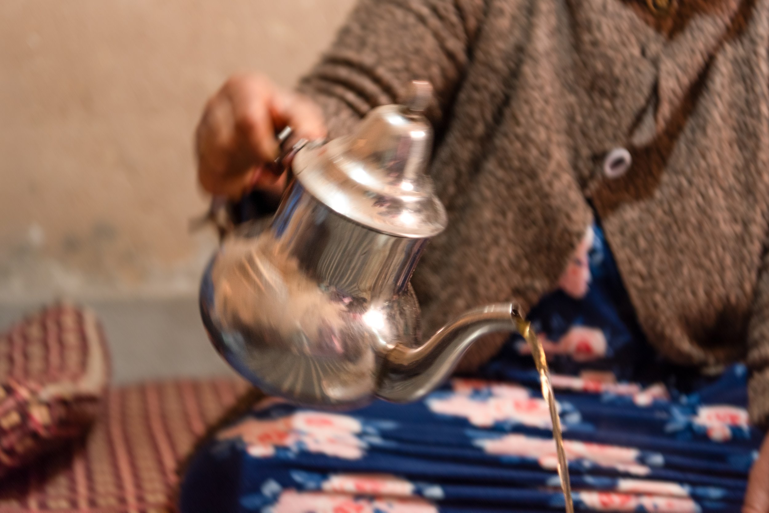 Morocco-Agouti-Village-Mama-Bia-pouring-tea-5.jpeg