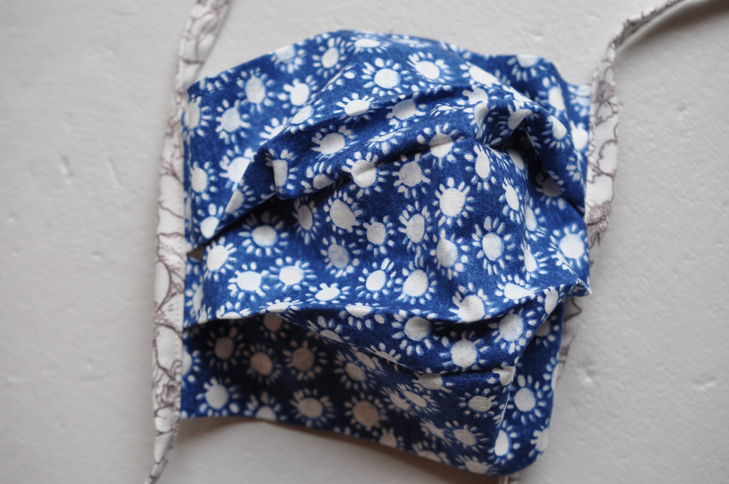 White Suns on Blue and Floral Mask