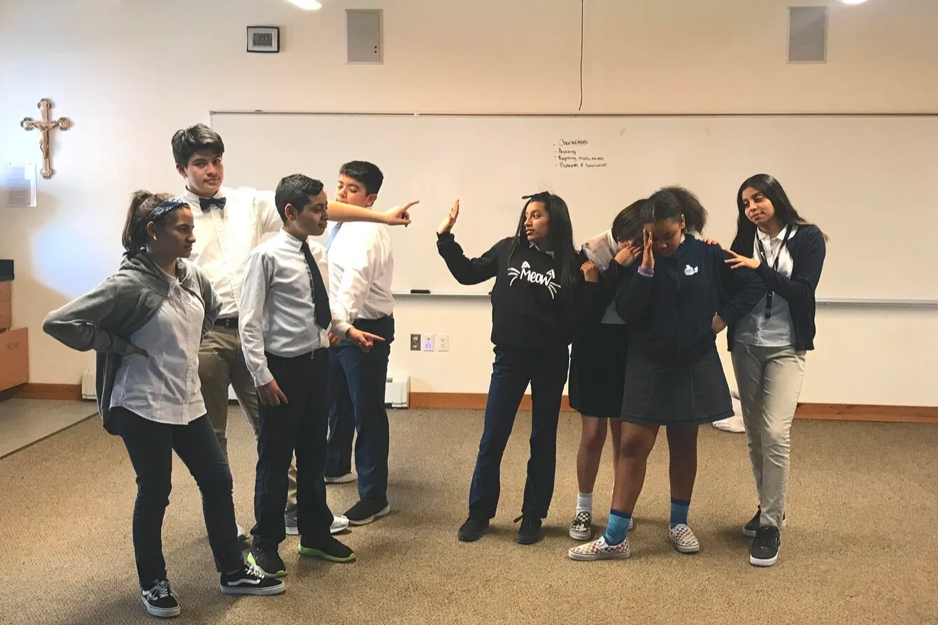 My middle school students demonstrating a powerful pose during a tableau game they loved doing.