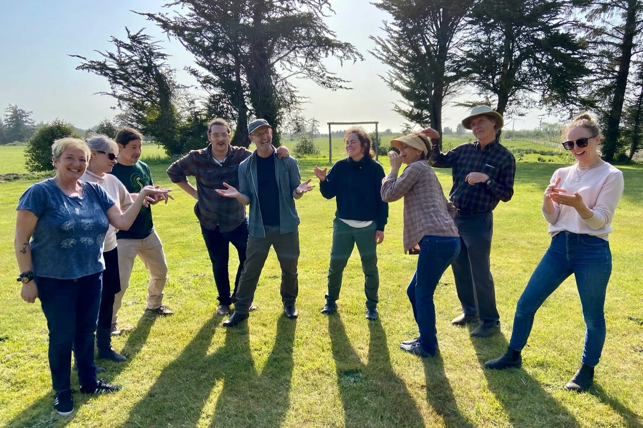 Participants in a community workshop in Langlois, Oregon posing in a tableau exercise.