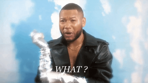 a black improviser improvising with a funny pose and saying WHAT?!