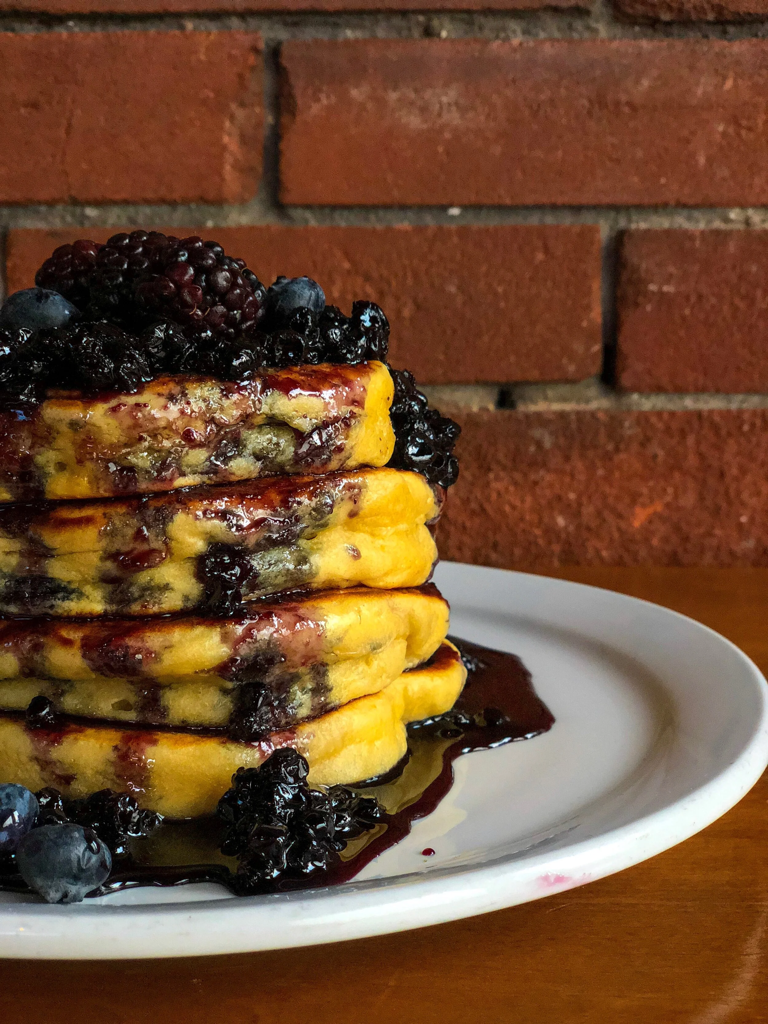 Stack of berry pancakes served for weekend brunch at SCHOOL Restaurant in Liberty Village, Toronto.