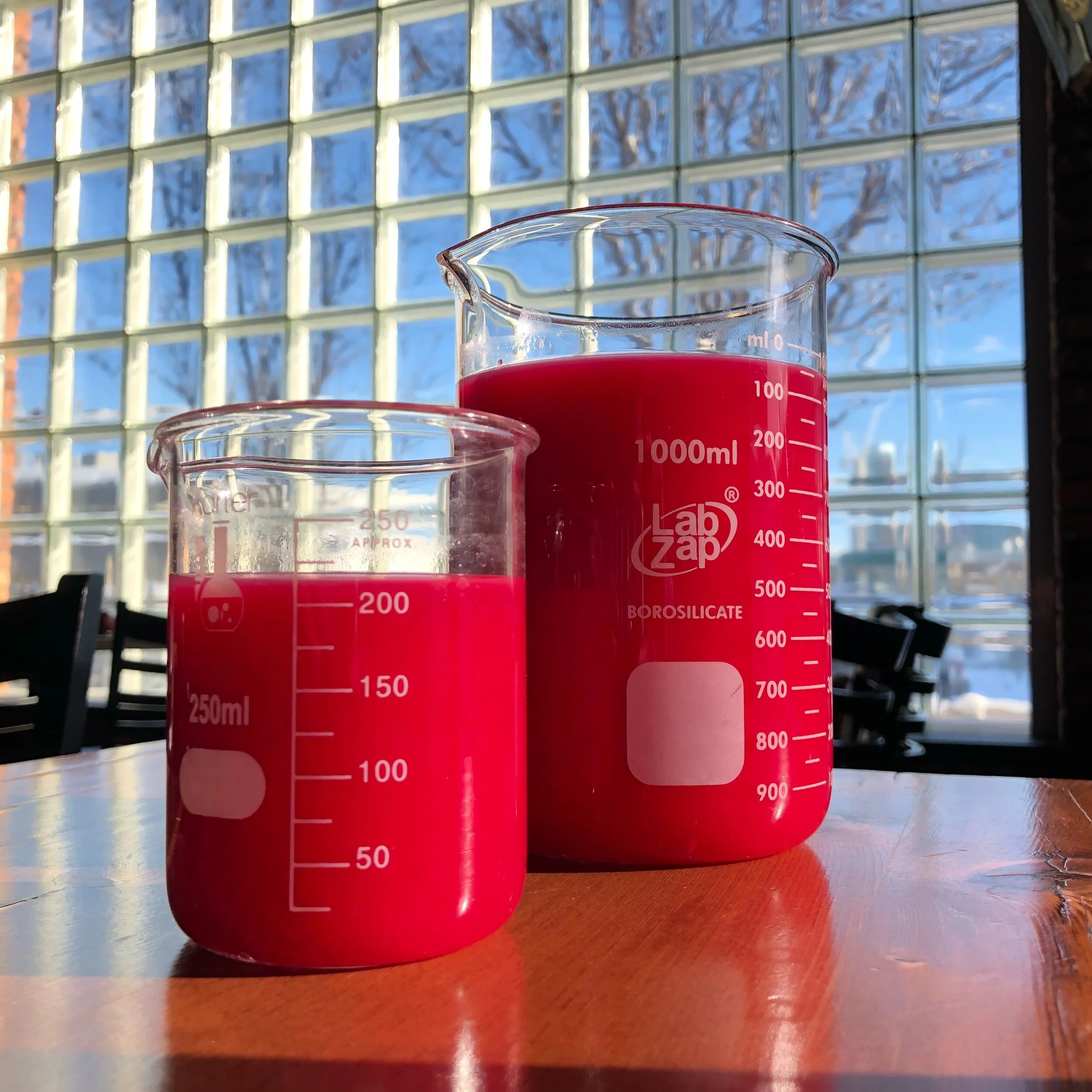 Brunch drinks served in lab beakers at SCHOOL Restaurant in Liberty Village, Toronto.