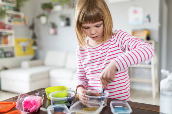 Ella making colorful slime