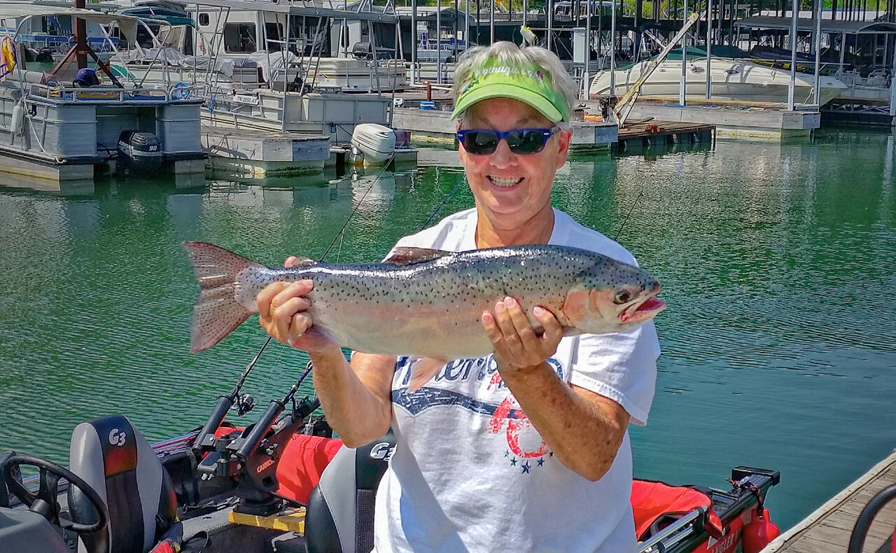20160908_125645 Lady holding fish on the dockw.jpg