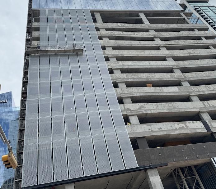 Perforated unitized garage screen Austin Landmark Facades.png