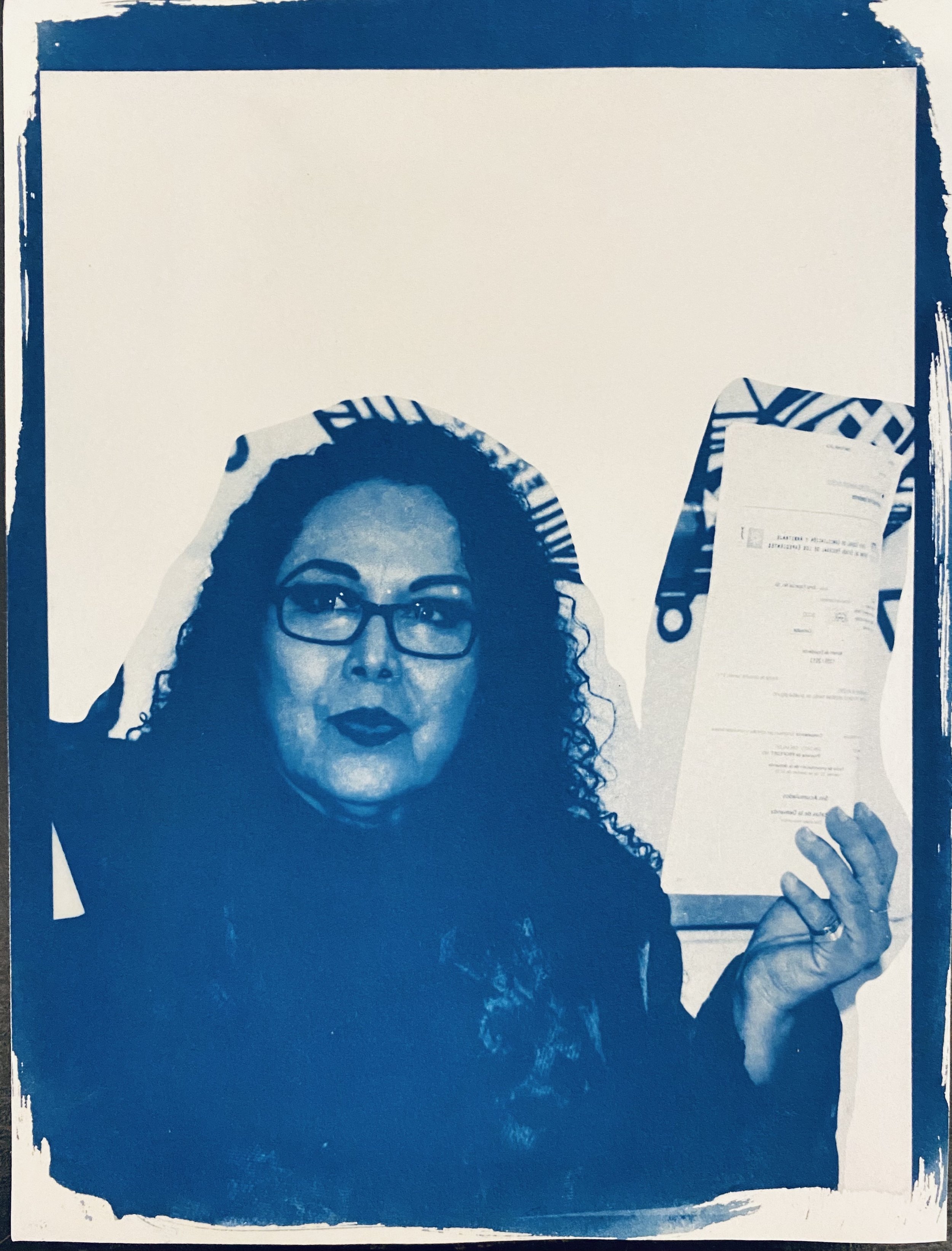 Lourdes holding the evidence, slain in 2022, cyanotype print on archival paper, 6 x 8 in, 2022