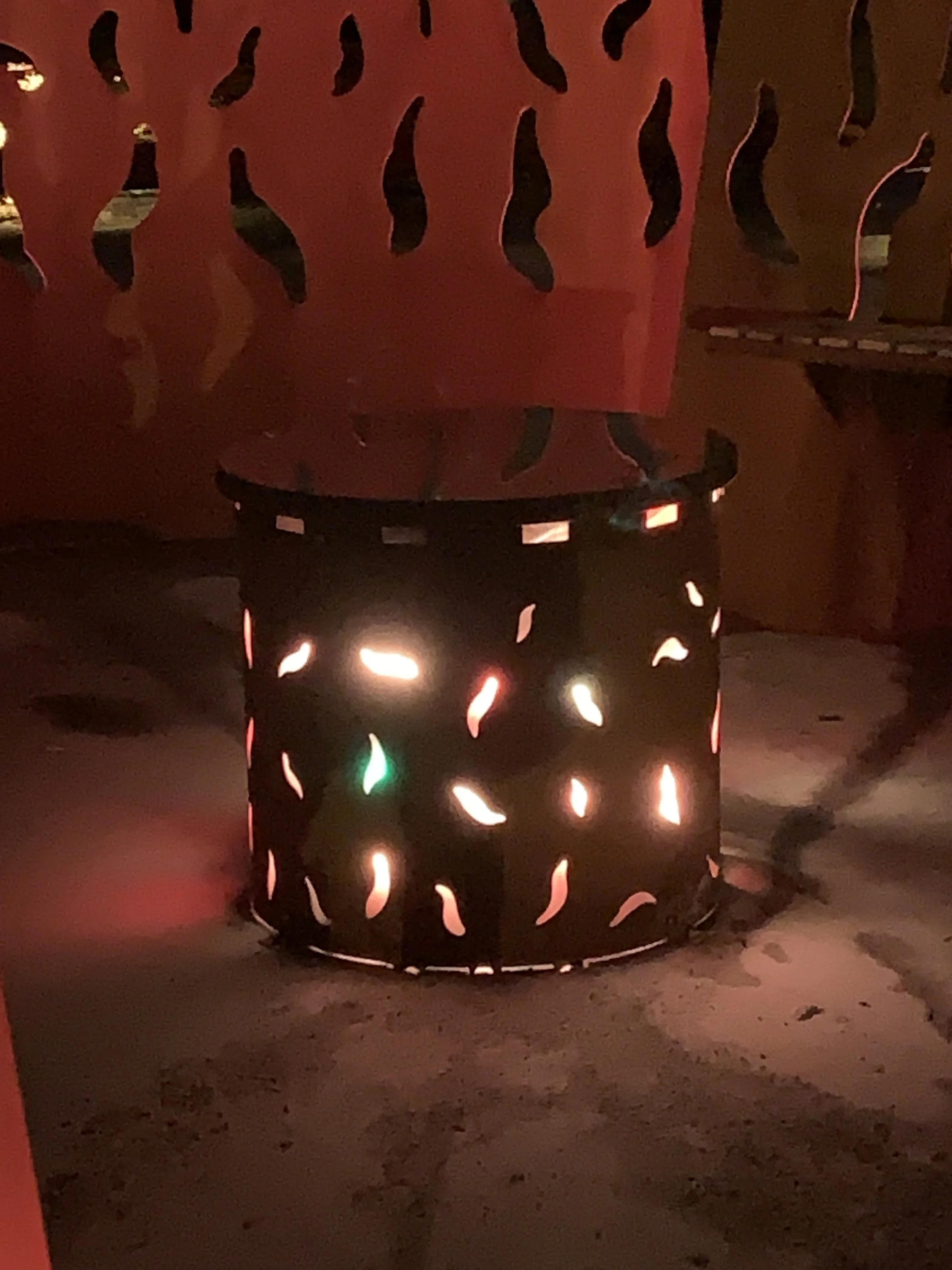 The Bonfire Ålesund night view with seats around the fireplace 3