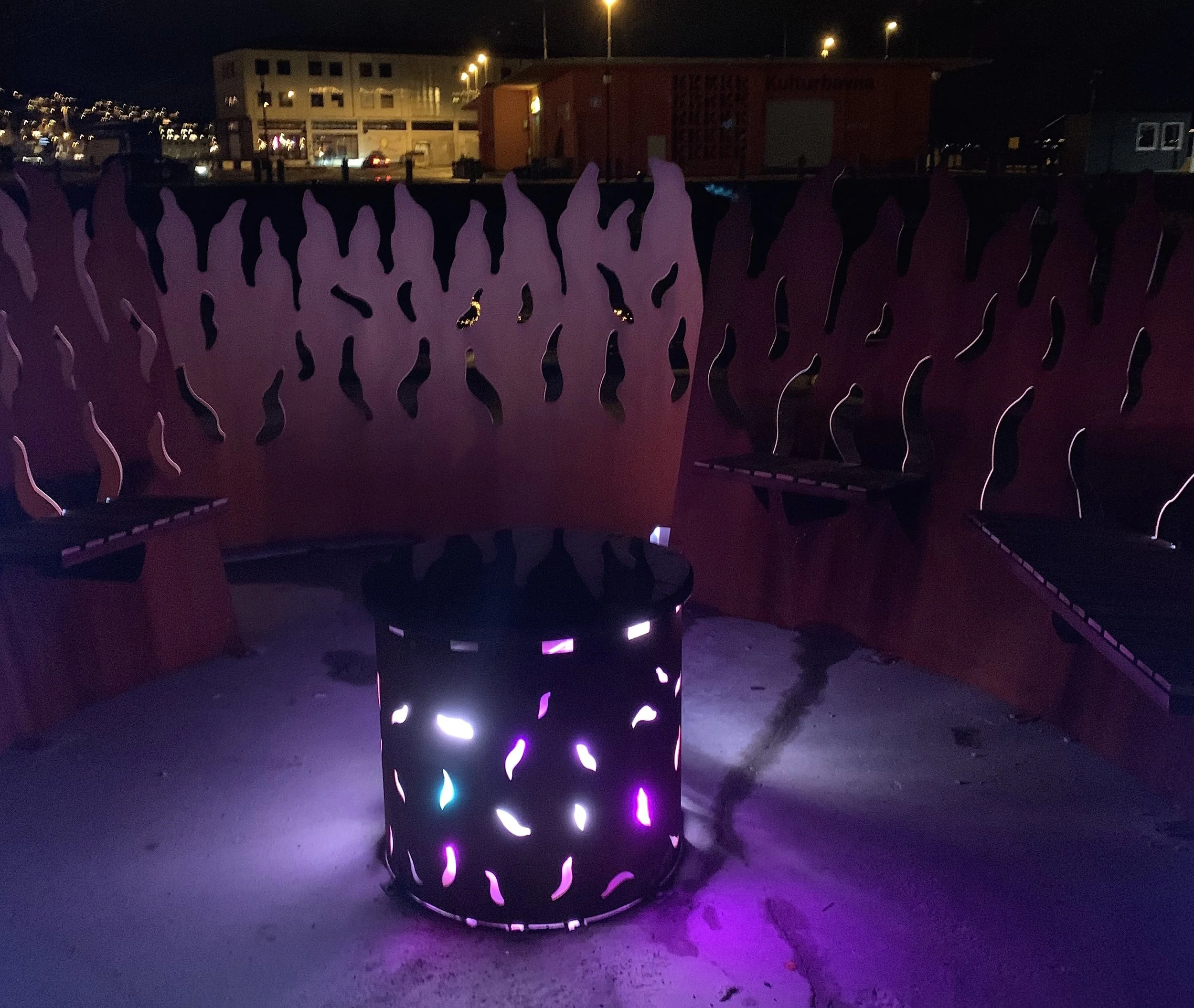 The Bonfire Ålesund night view with seats around the fireplace 1