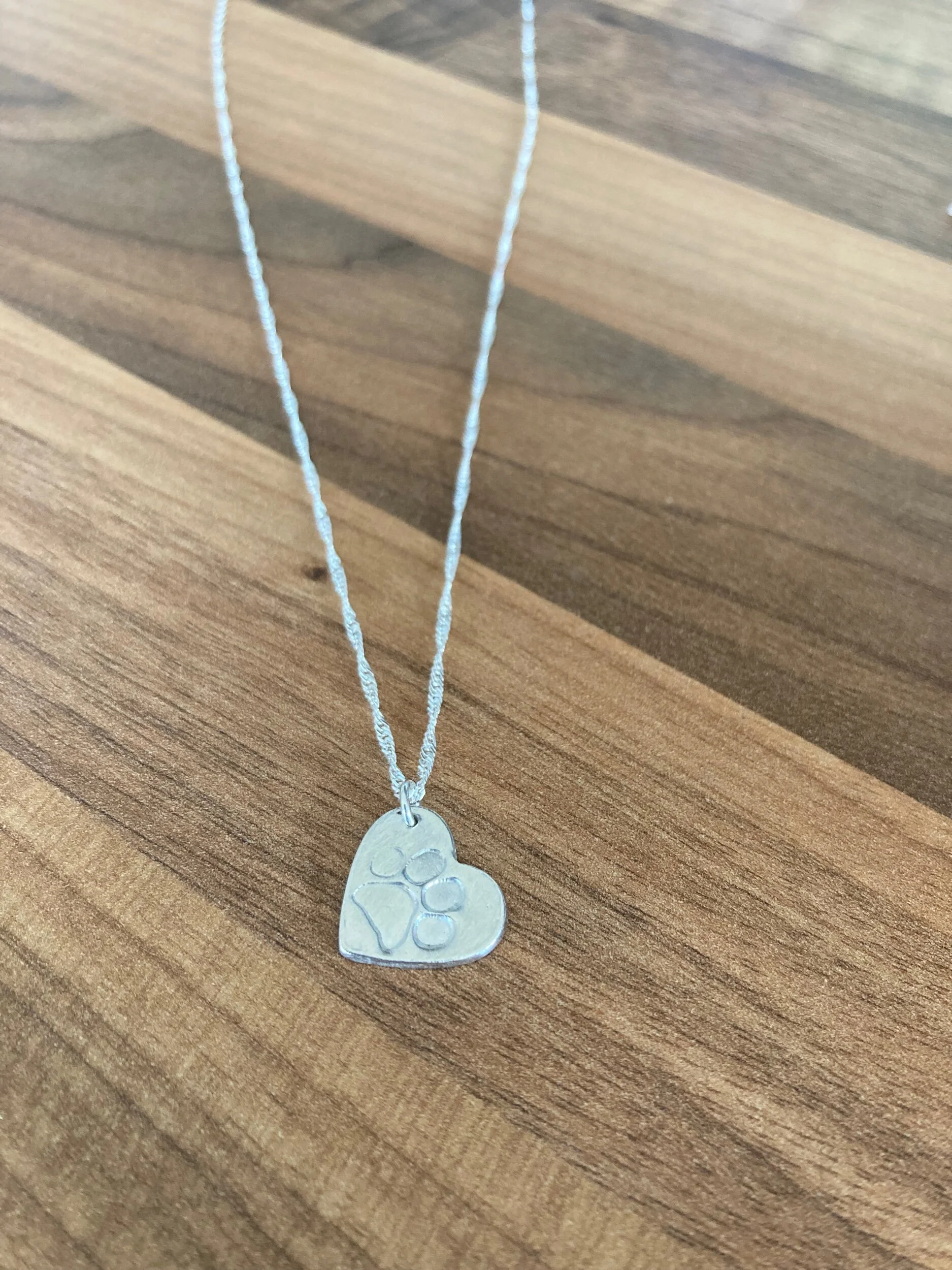 silver heart pendant with a paw print handmade gift