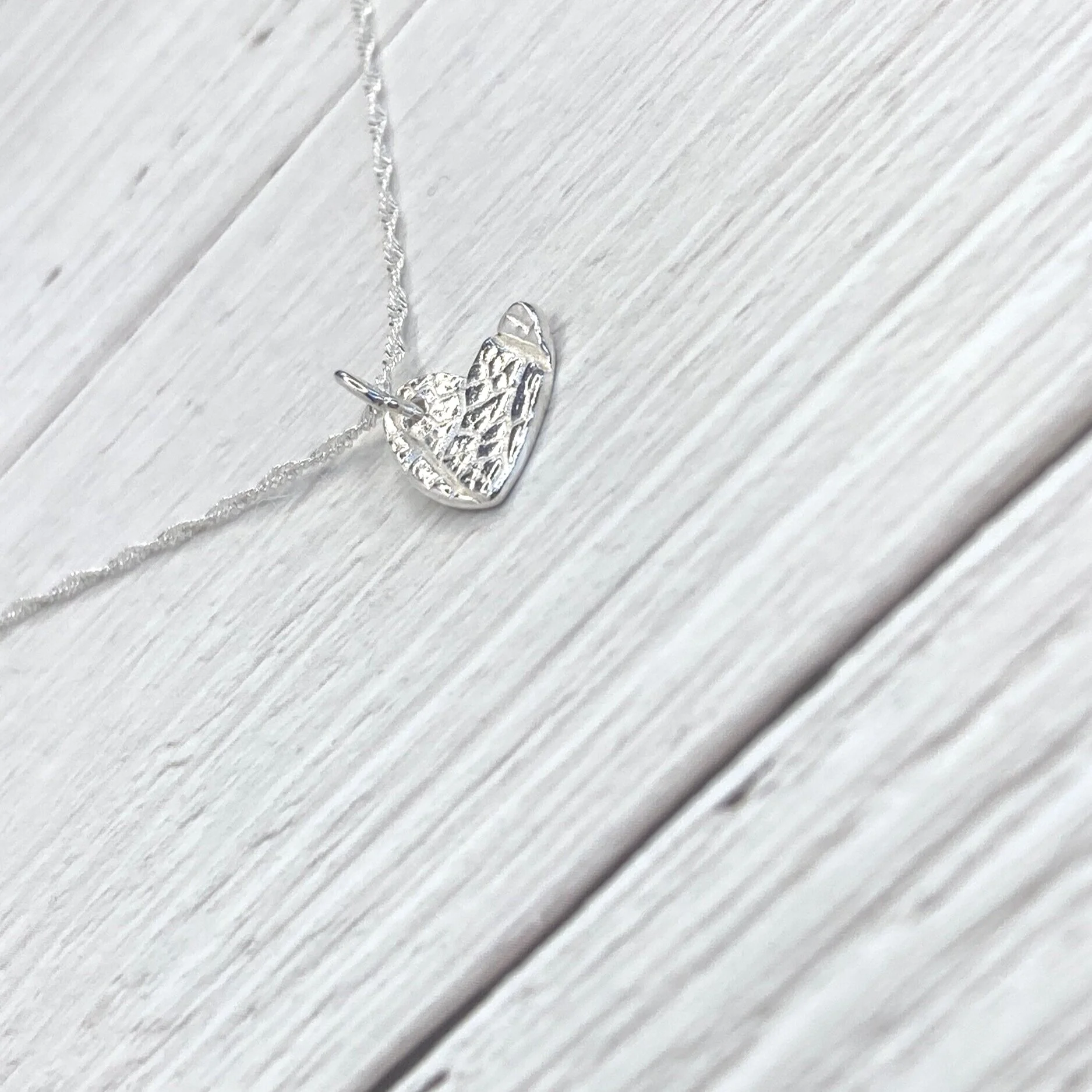 handmade nature inspired heart pendant with leaf texture