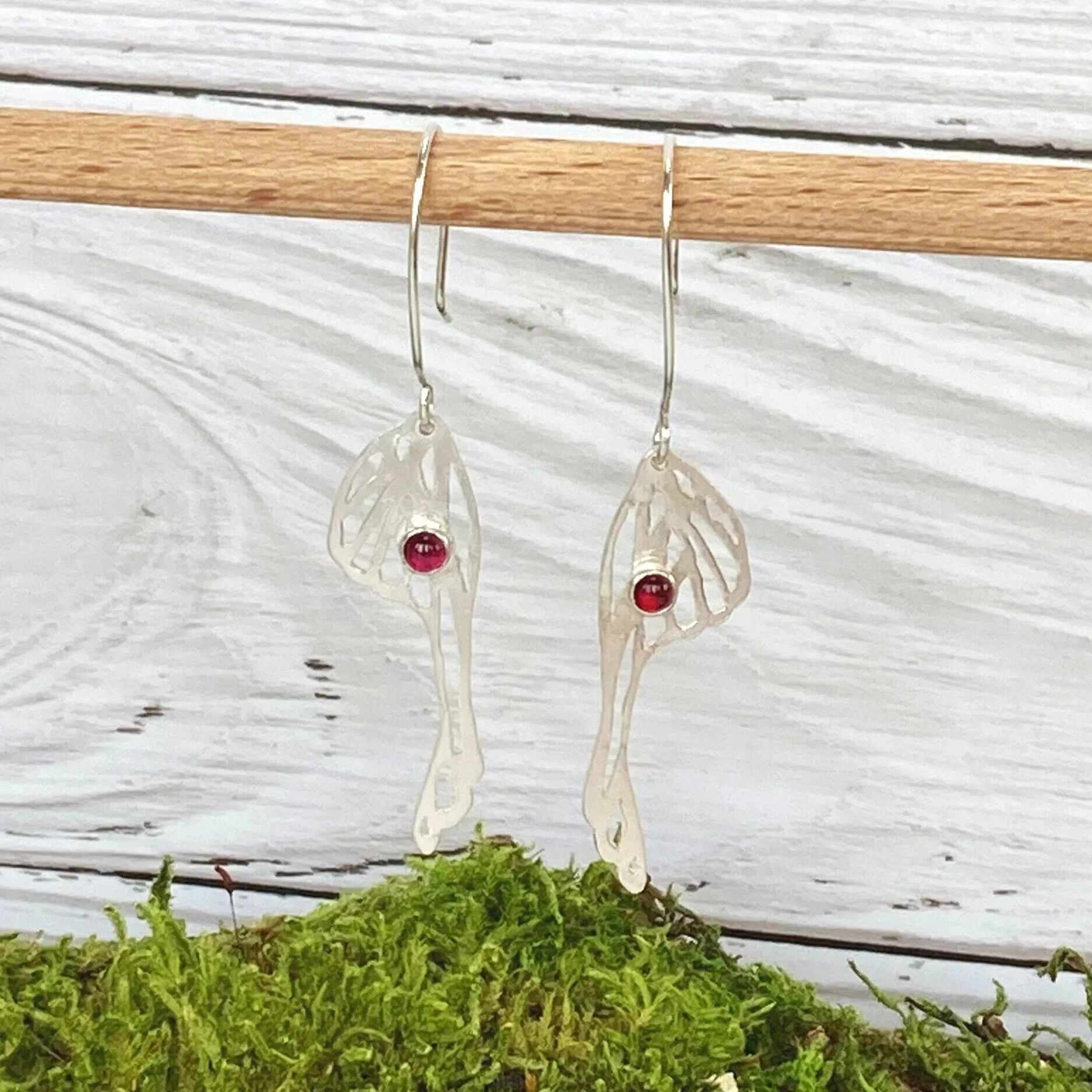 sterling silver saw pierced handmade earrings with garnet cabachon