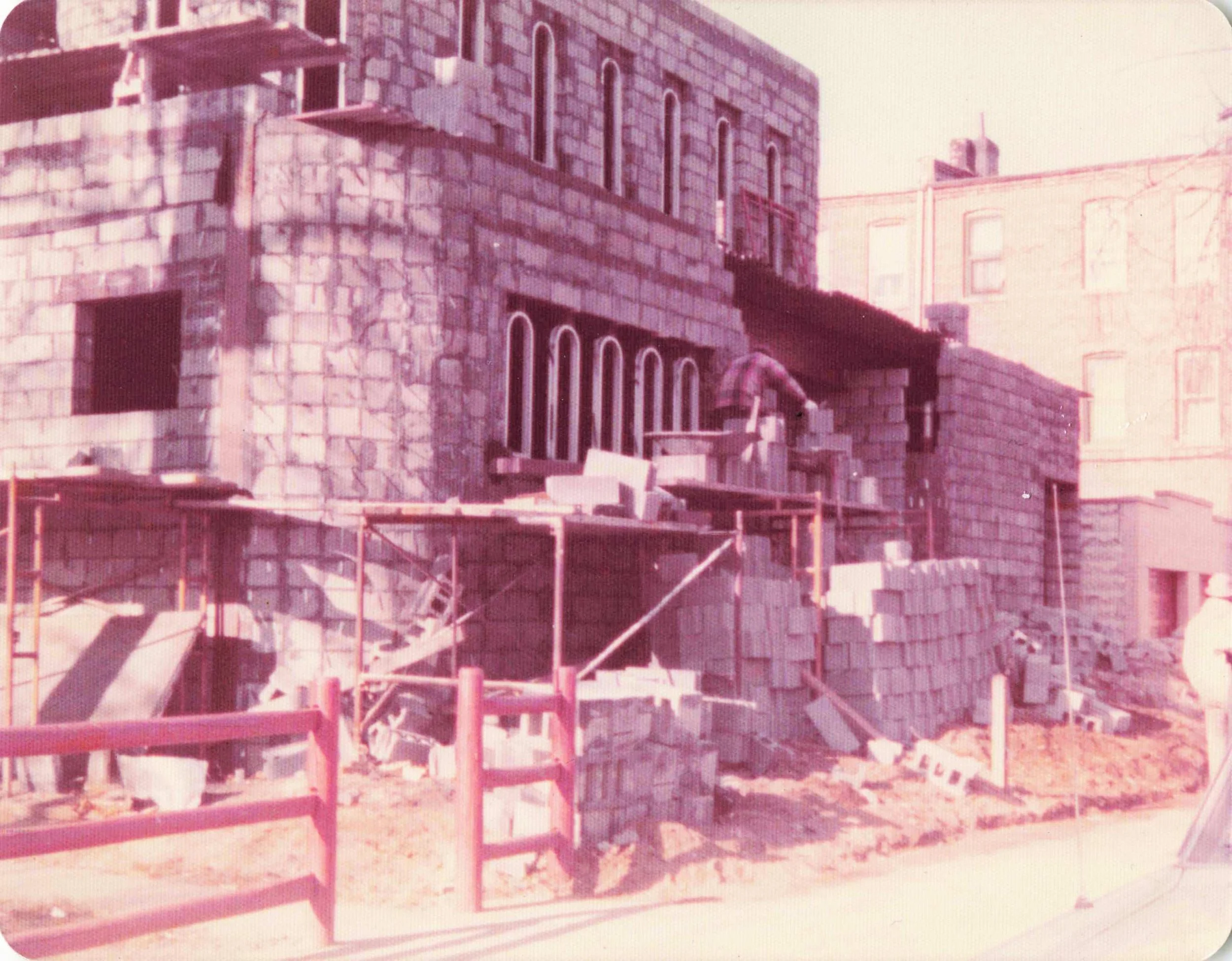 Stonework being installed during the construction of Il Palazzo di Villa Russo, 1975.