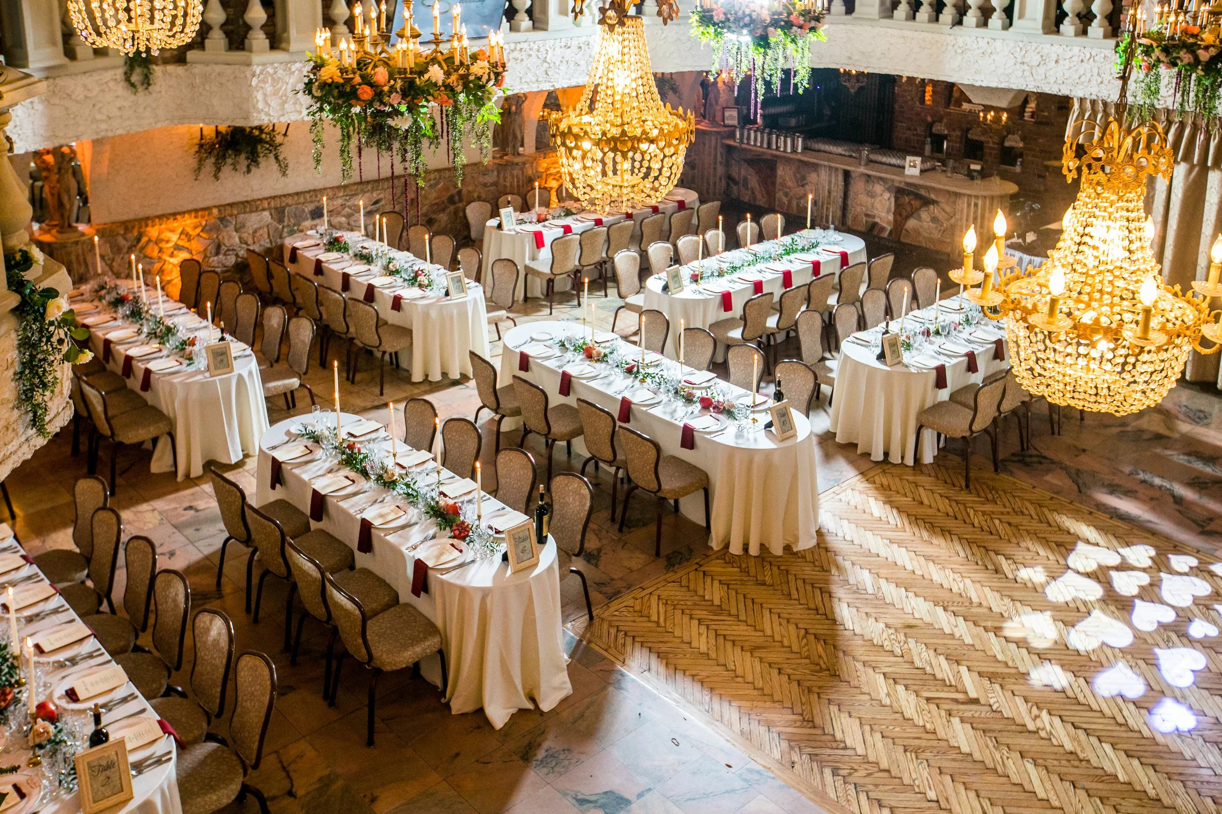 Luxury wedding reception layout with chandeliers and banquet tables inside Villa Russo Queens NY