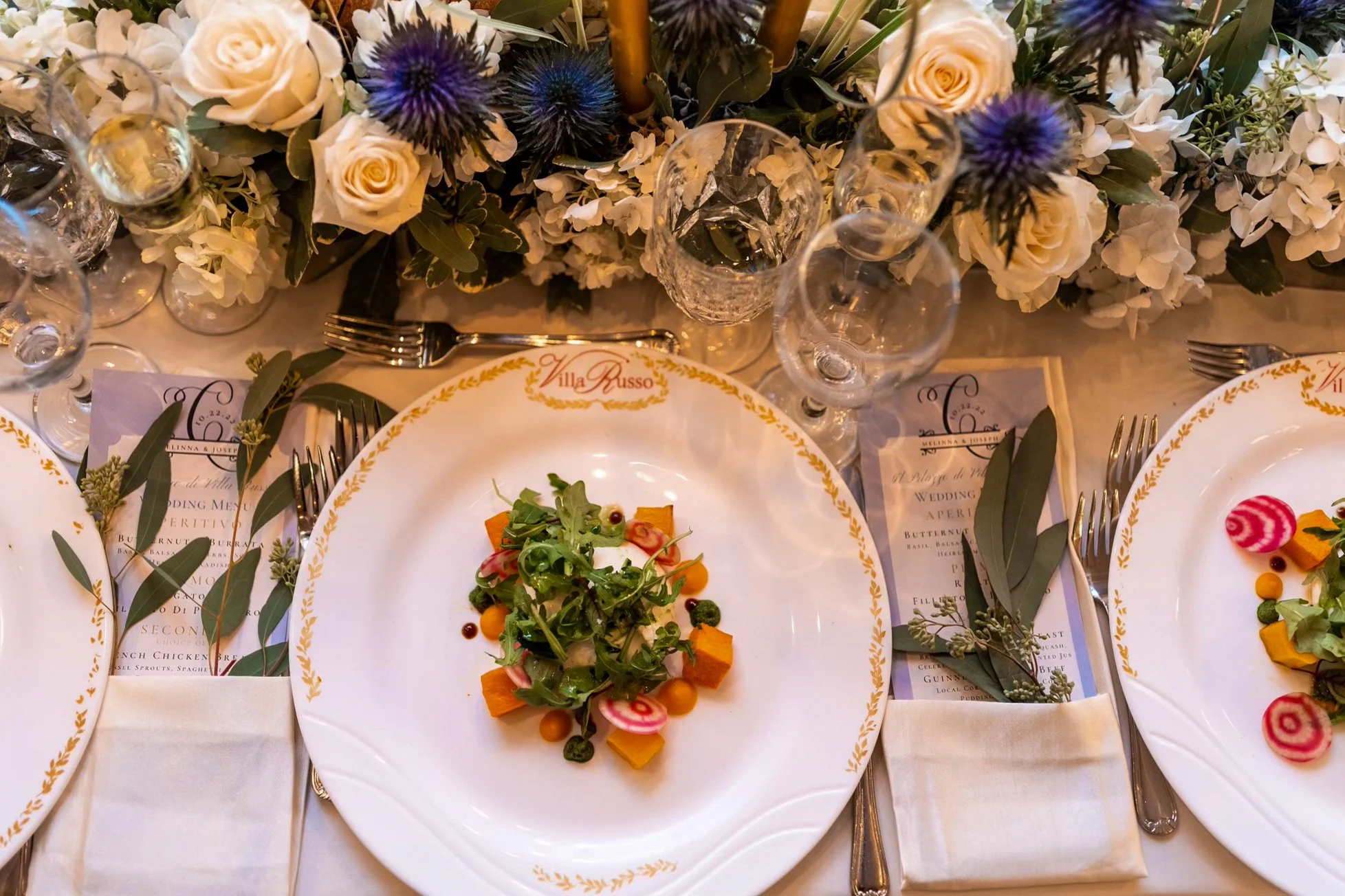 Elegant plated appetizer at Villa Russo with floral tablescape and fine dining setup in Queens NY