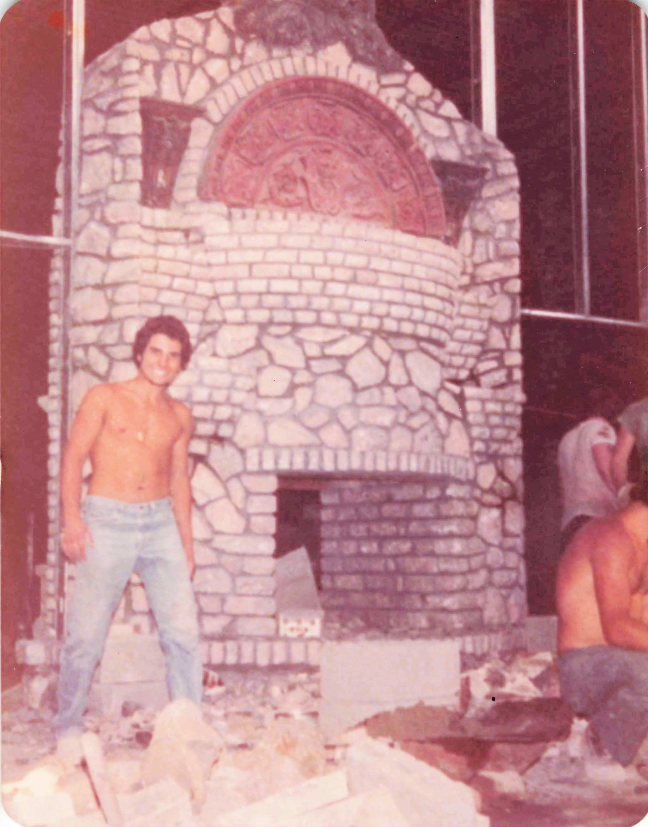 Construction of the stone fireplace in our Grotto room at Il Palazzo di Villa Russo, 1976.