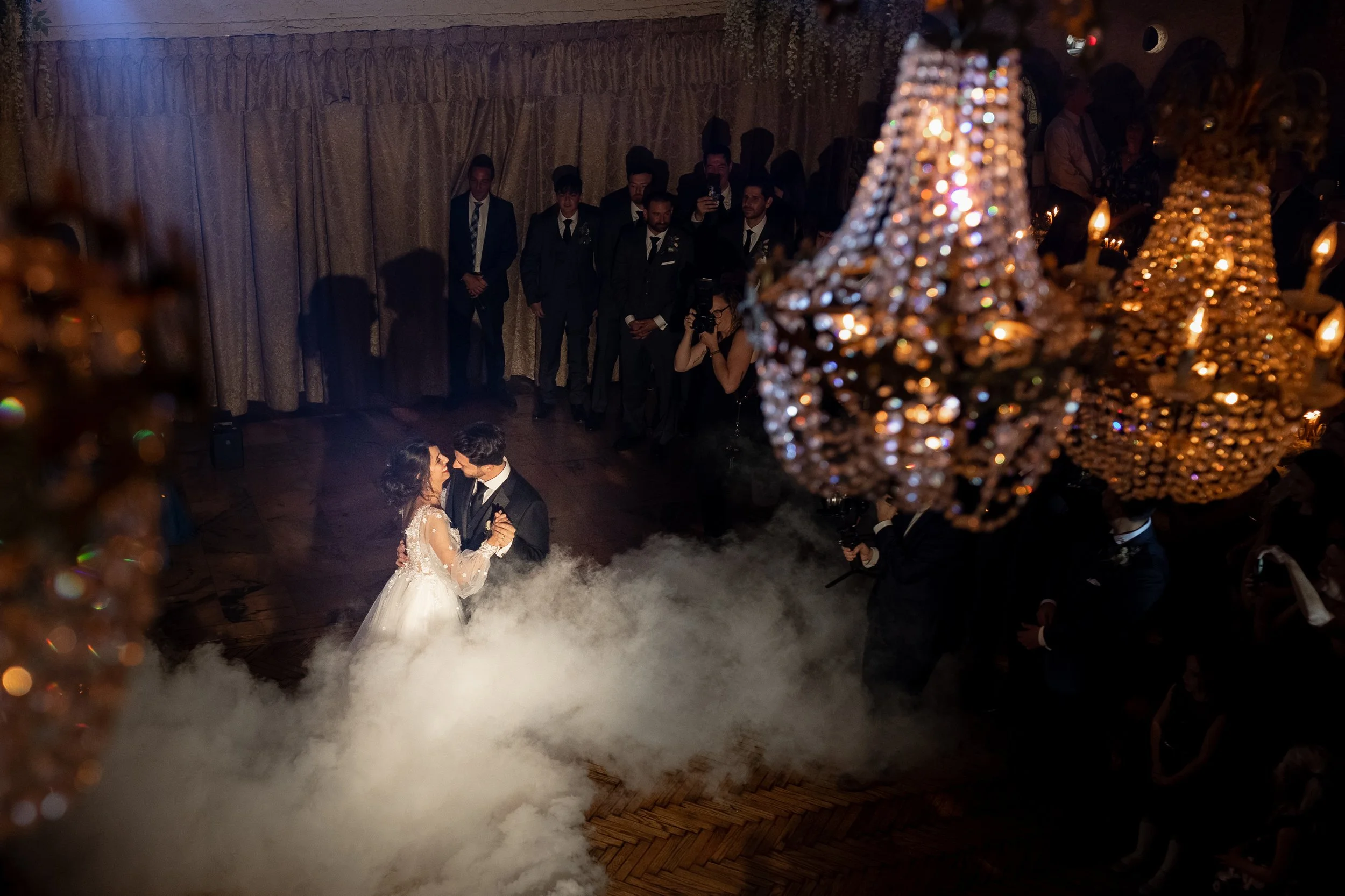 Romantic first dance with low fog and chandeliers at Villa Russo wedding venue in Queens NY