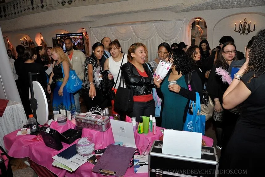 Vendor tables set up for a community expo and networking event.