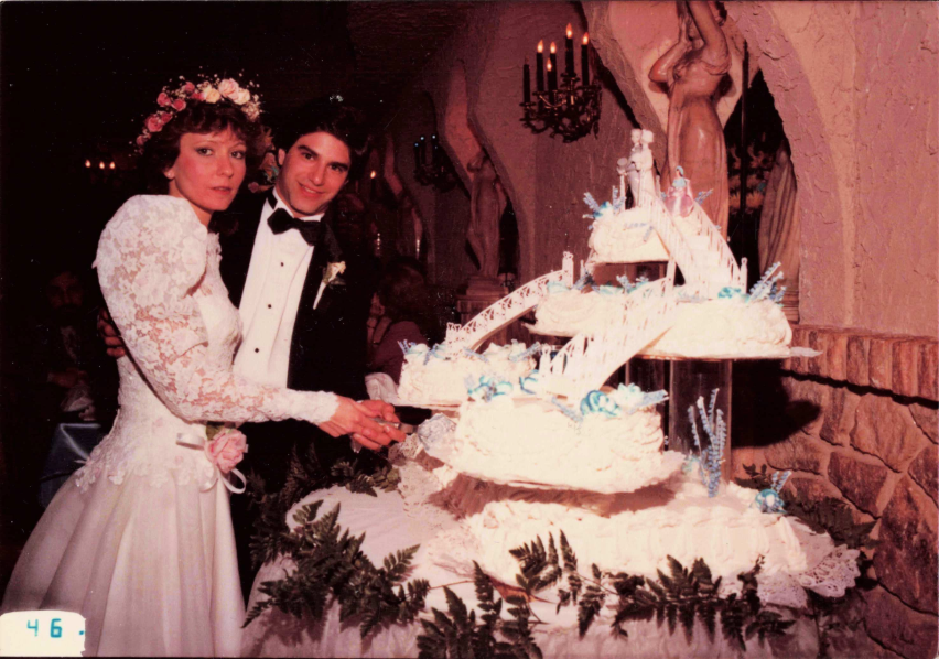 George and Antha Russo cutting their wedding cake at Villa Russo in 1982.