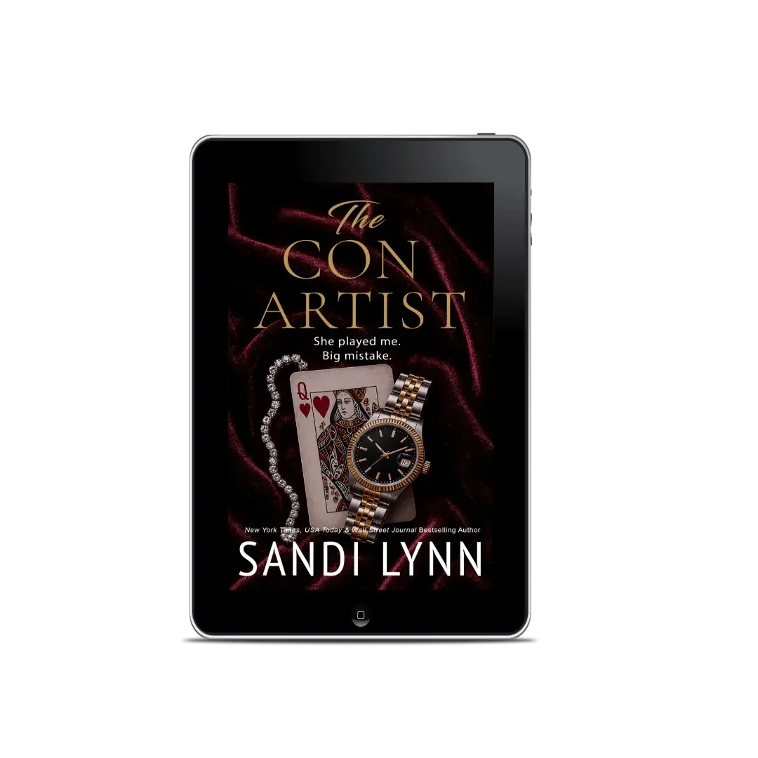 Cover of a book titled 'The Con Artist' by Sandi Lynn, displayed on a tablet screen. The cover features a playing card, a pearl necklace, and a gold and silver watch, with the author's name at the bottom.