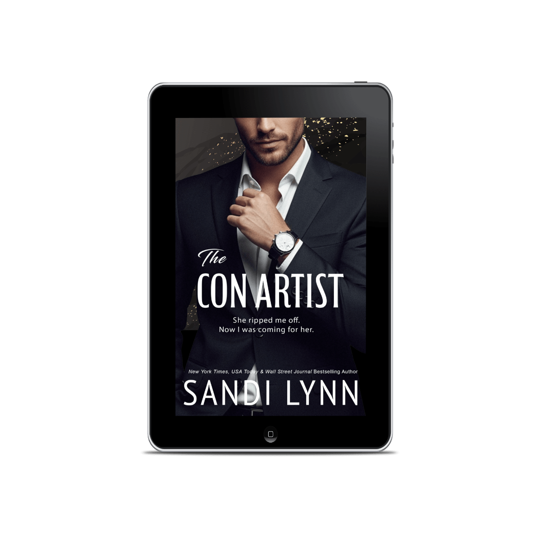 E-book cover of 'The Con Artist' by Sandi Lynn, featuring a man in a suit wearing a watch, holding his collar, with city lights in the background.