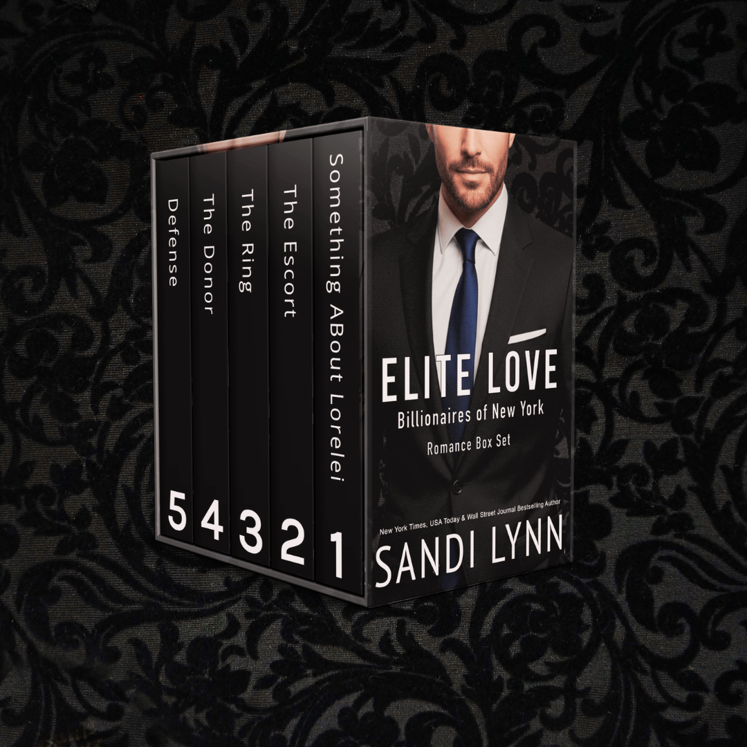 A boxed set of romance novels titled "Elite Love: Billionaires of New York" authored by Sandi Lynn. The box set includes five books numbered from 1 to 5, with titles "Something About Lorelei," "The Escort," "The Ring," "The Donor," and "The Defense." The box features a man in a suit with a white shirt and dark tie on the front.